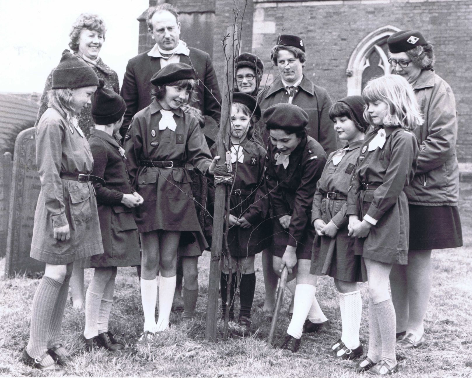 1st Carlton Brownie Pack planting a copper beech tree in 1977